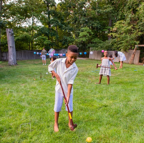 children playing cricket at lawn party