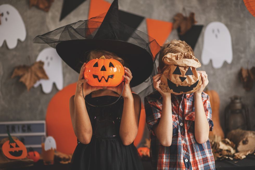 children playing with halloween decoration