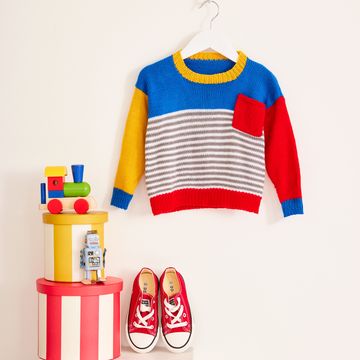 childs jumper on hanger with trainers and toys