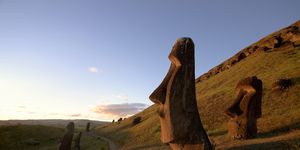 chile, easter island, moai statues of rano raraku at dusk