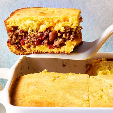 Chili-Stuffed Cornbread cornbread in a casserole dish with a layer of chili in the middle