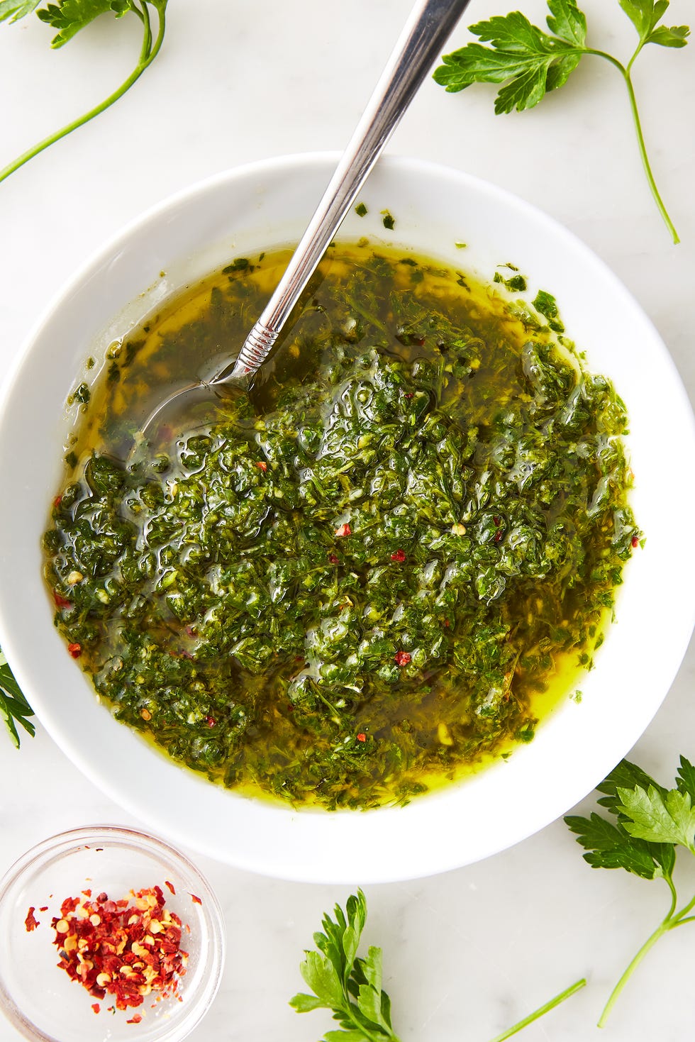 chimichurri sauce in a white bowl