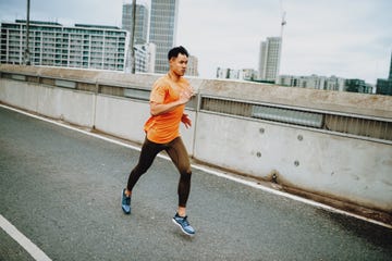 chinese athlete jogging on cloudy day outdoors