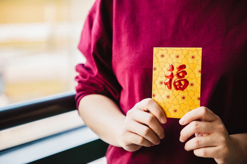 chinese new year celebration give or receiving red envelop