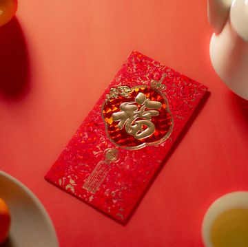 chinese new year food and drink still life with red envelope ang pao