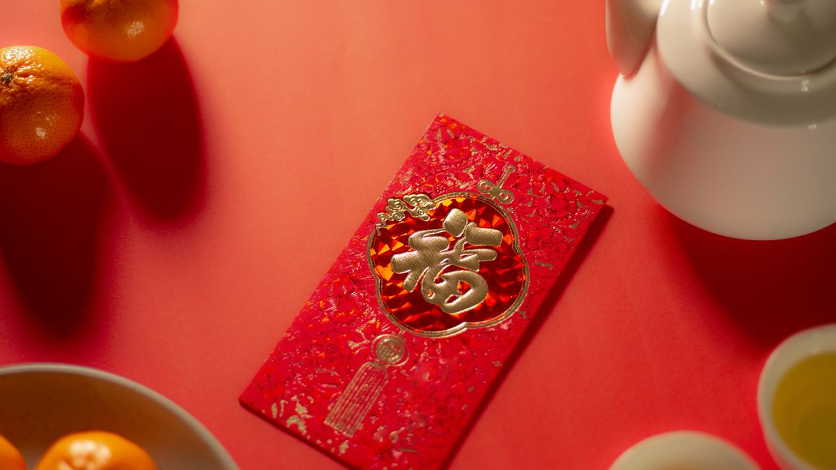 chinese new year food and drink still life with red envelope ang pao