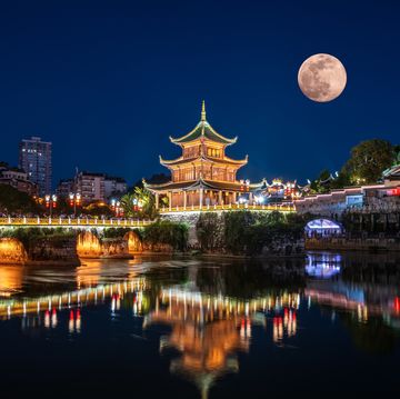 chinese traditional architecture under a full moon