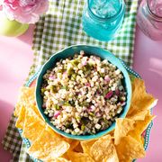 chipotle corn salsa recipe with chips in blue bowl