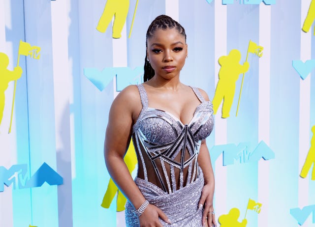 Chloë Wears Silver Gown with Highest Leg Slit at 2022 MTV VMAs