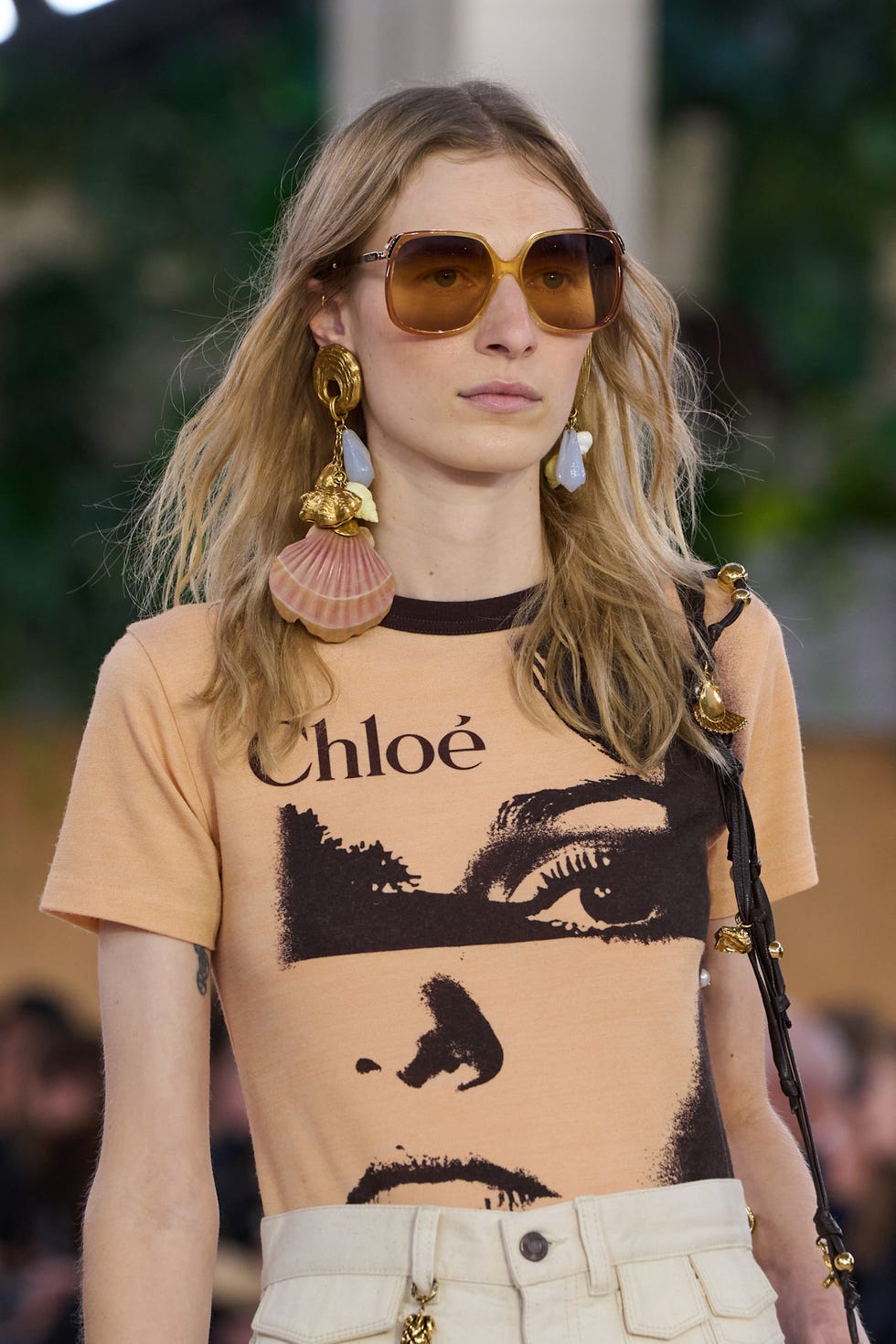 Fashion model showcasing a trendy outfit with notable accessories