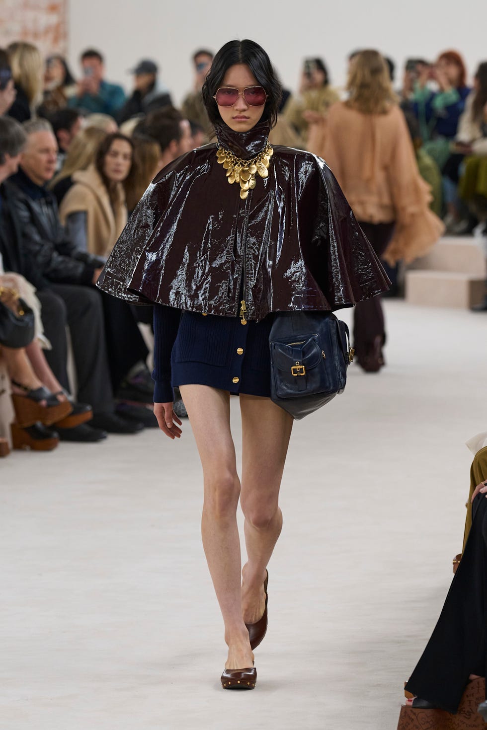 Fashion model showcasing a contemporary outfit on a runway