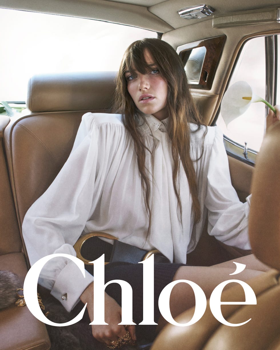 a fashionfocused scene set in a car interior featuring a subject styled elegantly