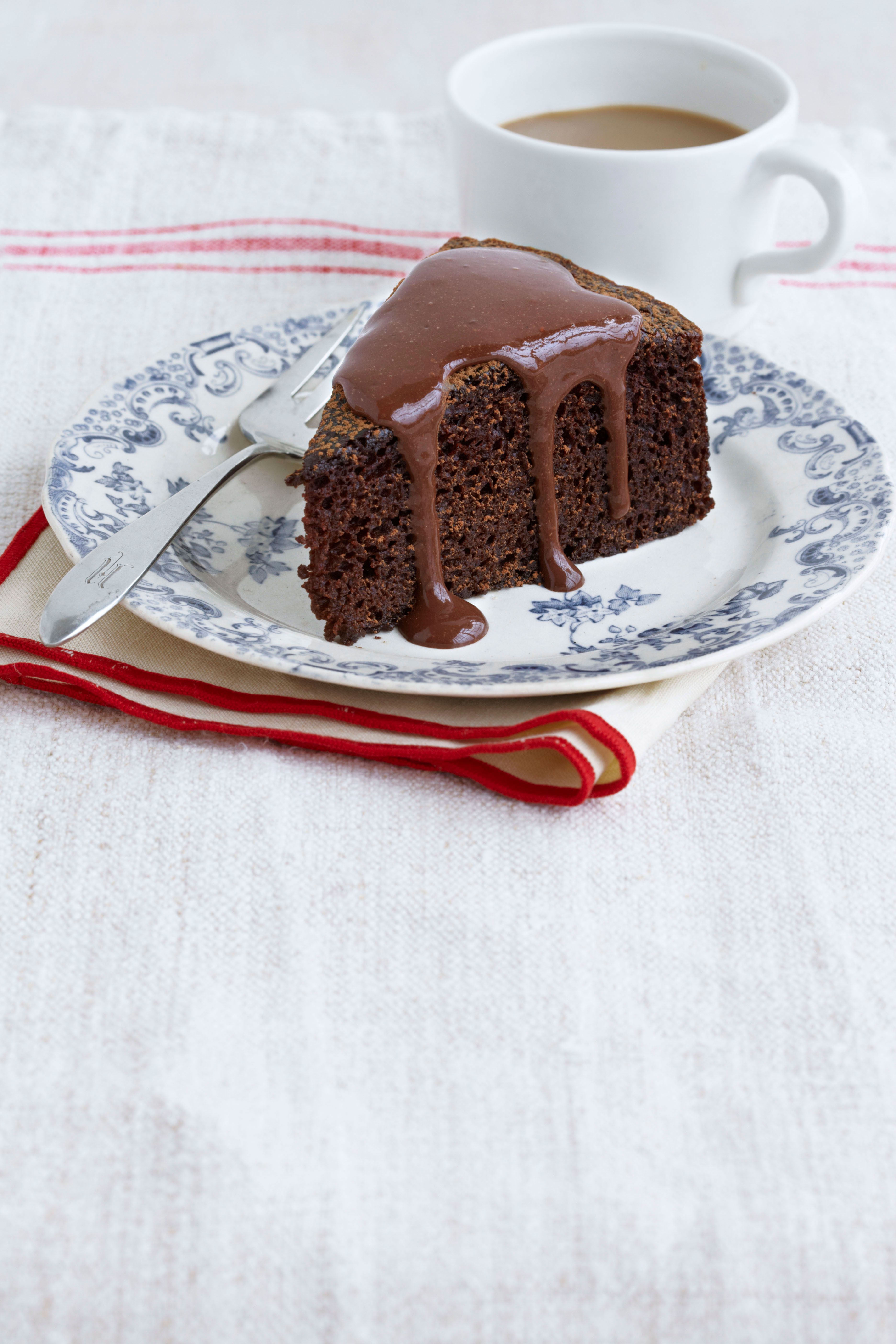 Chocolate cake with caramel icing and fudge sauce | Woolworths TASTE