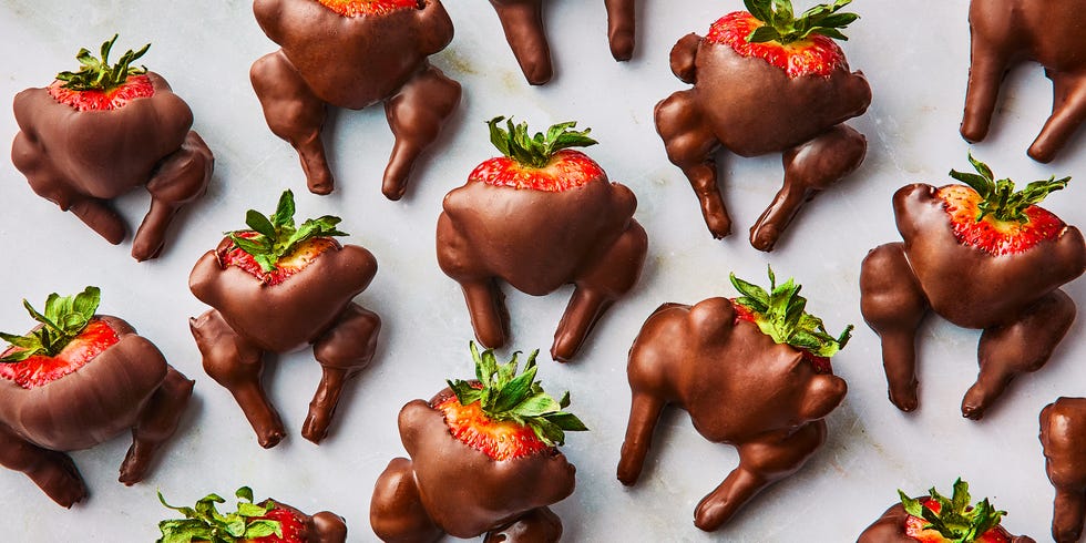 chocolate covered strawberry decorated with pretzel sticks and mini marshmallows to look like turkeys
