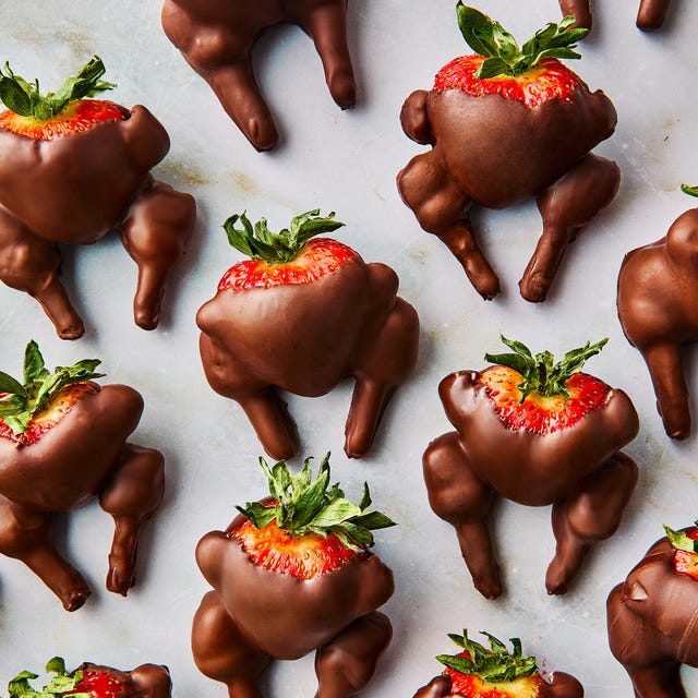 chocolate covered strawberry decorated with pretzel sticks and mini marshmallows to look like turkeys