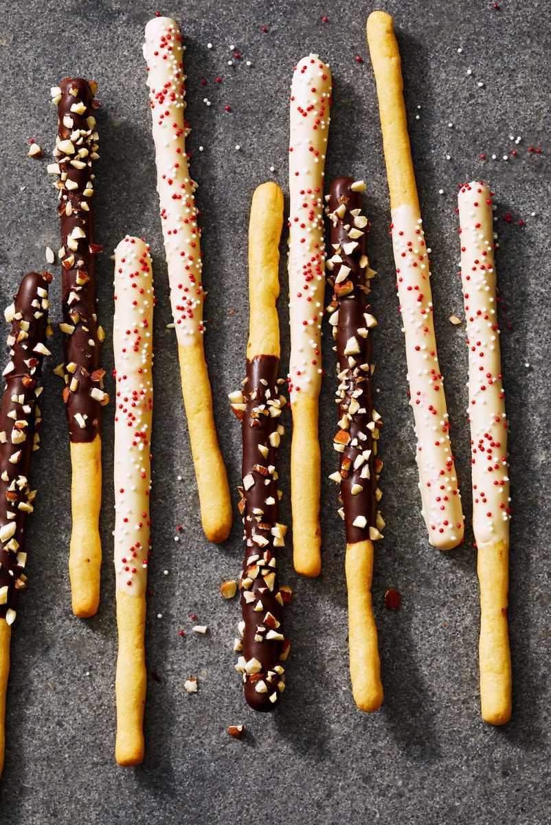 chocolate dipped cookie sticks with sprinkles chopped nuts