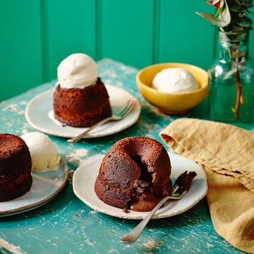 chocolate fondant a table with plates of desserts
