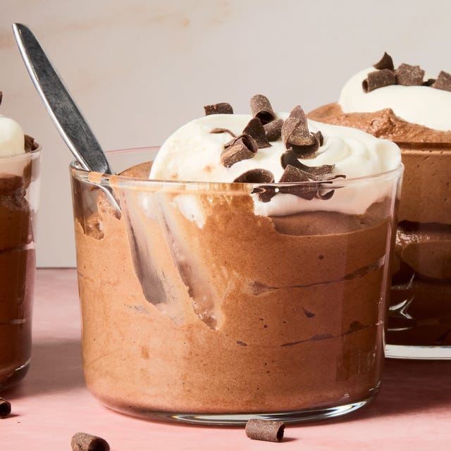Chocolate Mousse chocolate mousse in containers topped with whipped cream and chocolate shavings