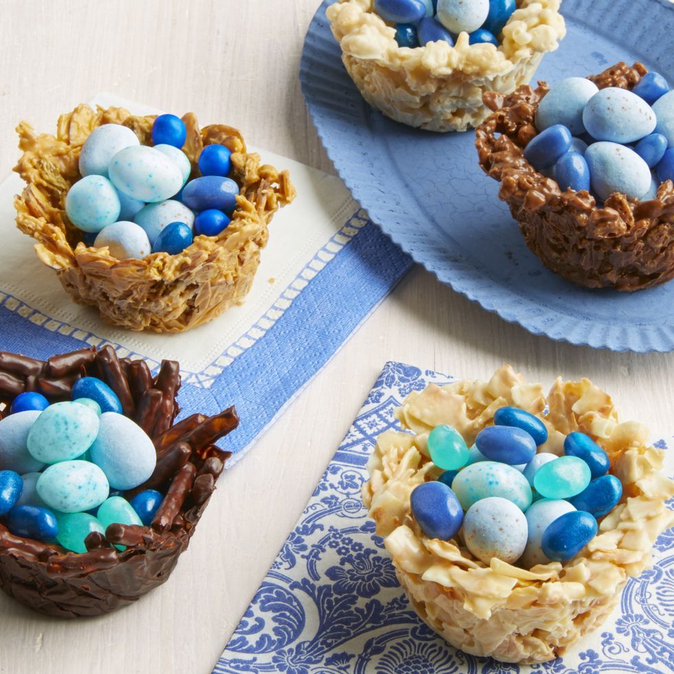 easter egg nests made out of pretzels, cereal, and rice cereal filled with candy