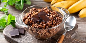 chocolate oatmeal or oat porridge with chocolate on top served in small bowl selective focus