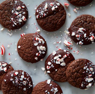 chocolate peppermint cookies half covered in chocolate with crushed peppermint candies