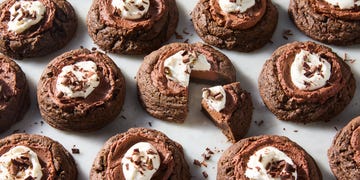 chocolate pie cookies topped with whipped cream and chocolate shavings