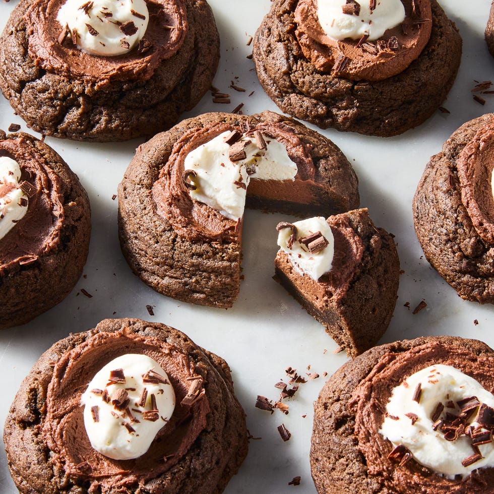 chocolate pie cookies topped with whipped cream and chocolate shavings