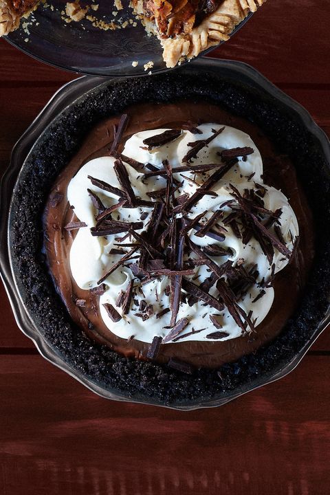 mocha chocolate cream pie in a metal pie plate with whipped cream and shaved chocolate on top