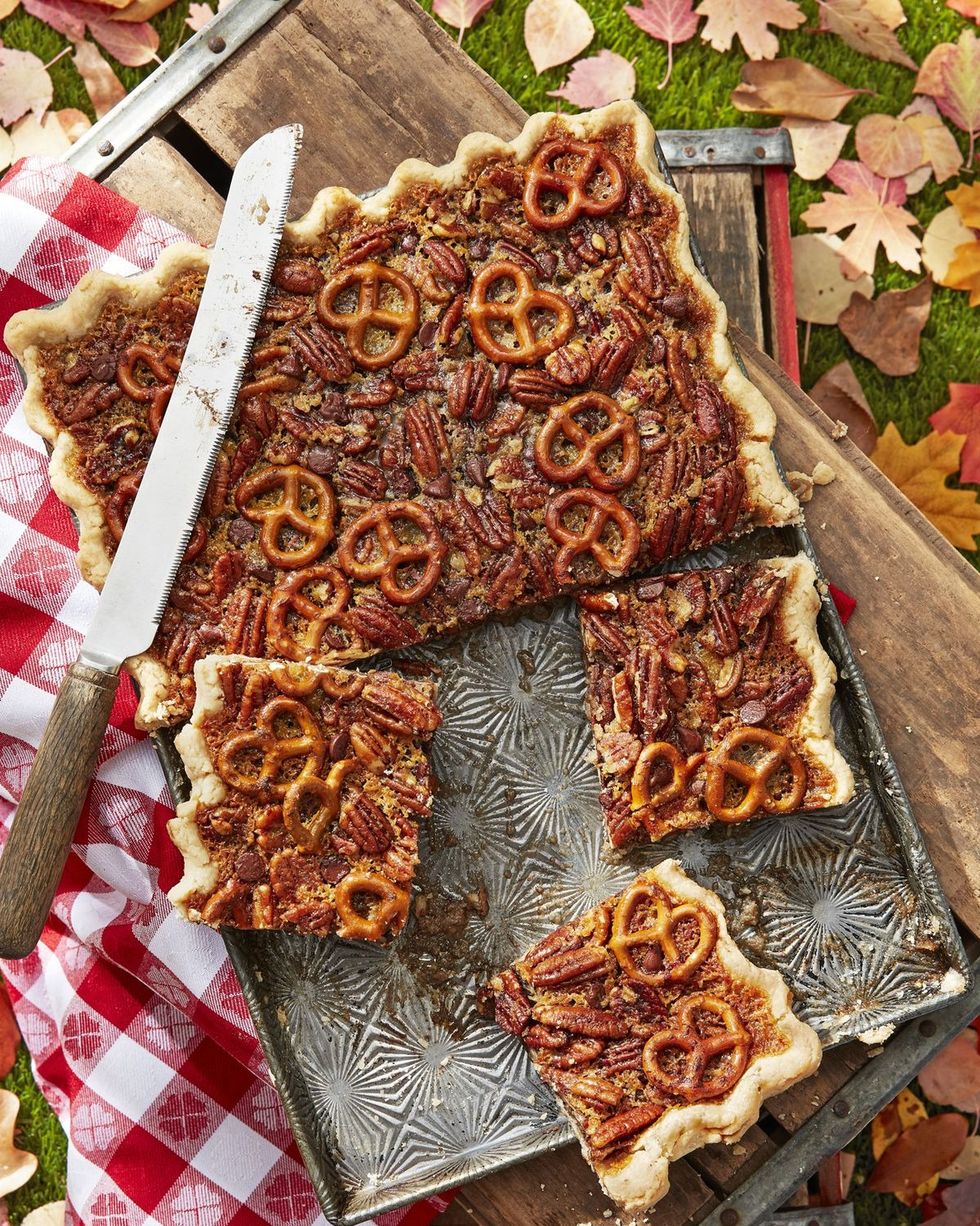 pretzel chocolate pecan slab pie in a rectangle pan with pieces cut into squares
