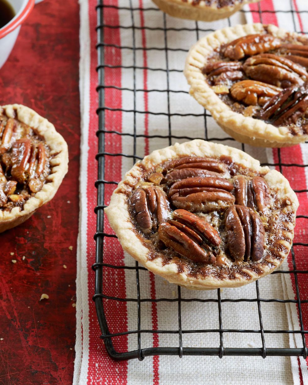 chocolate pecan tartlets on a wire rack