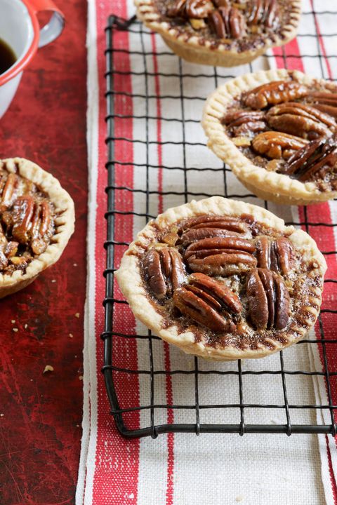chocolate pecan tartlets on a wire rack