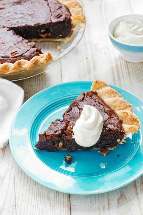 a slice of tar heel chocolate pie with a dollop of whipped cream on top