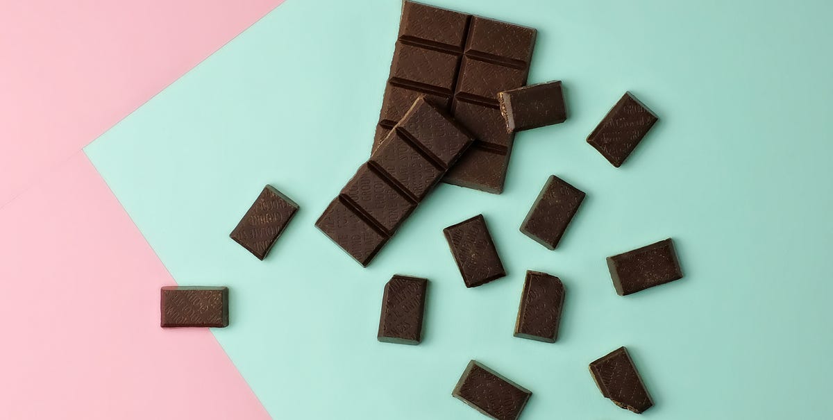 Chocolate pieces on color block background Chocolate pieces on color block background