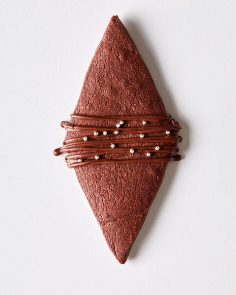 chocolate shortbread cookies shaped like diamonds with a chocolate drizzle
