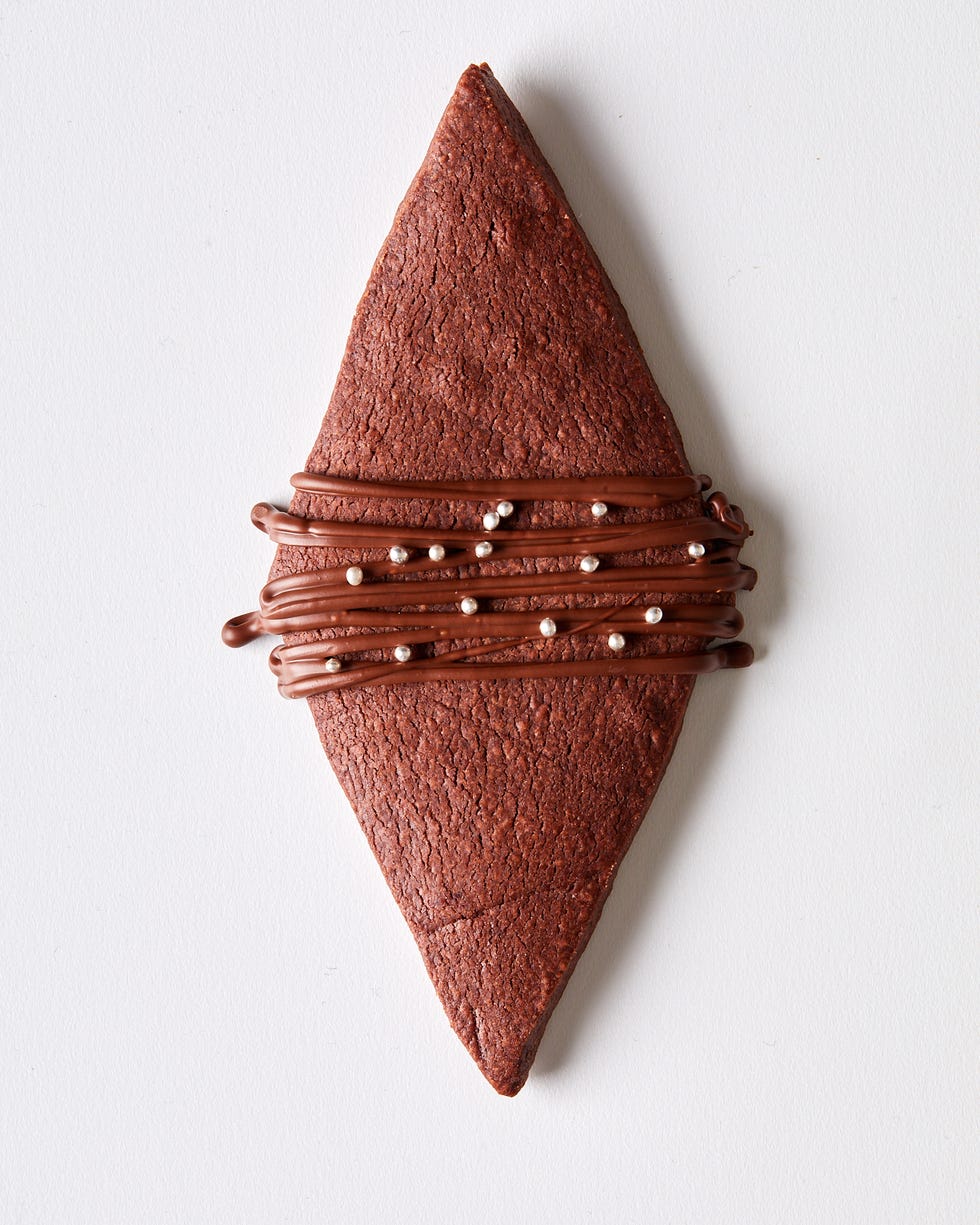 chocolate shortbread cookies shaped like diamonds with a chocolate drizzle