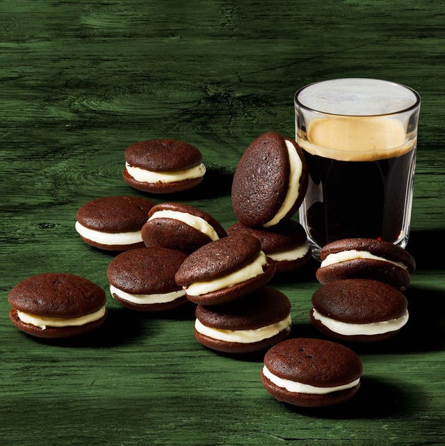 chocolate whoopie pies next to a glass of dark beer