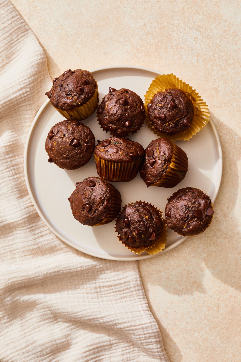 chocolate zucchini bran muffins on a plate