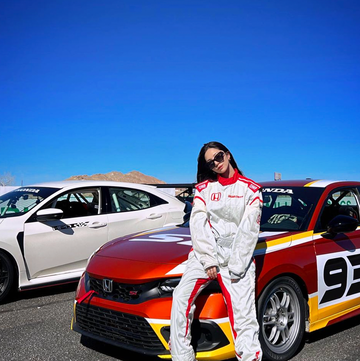 drift racer sara choi sitting on her car