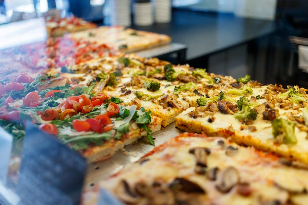 choice of pizza al taglio in retail glass showcase