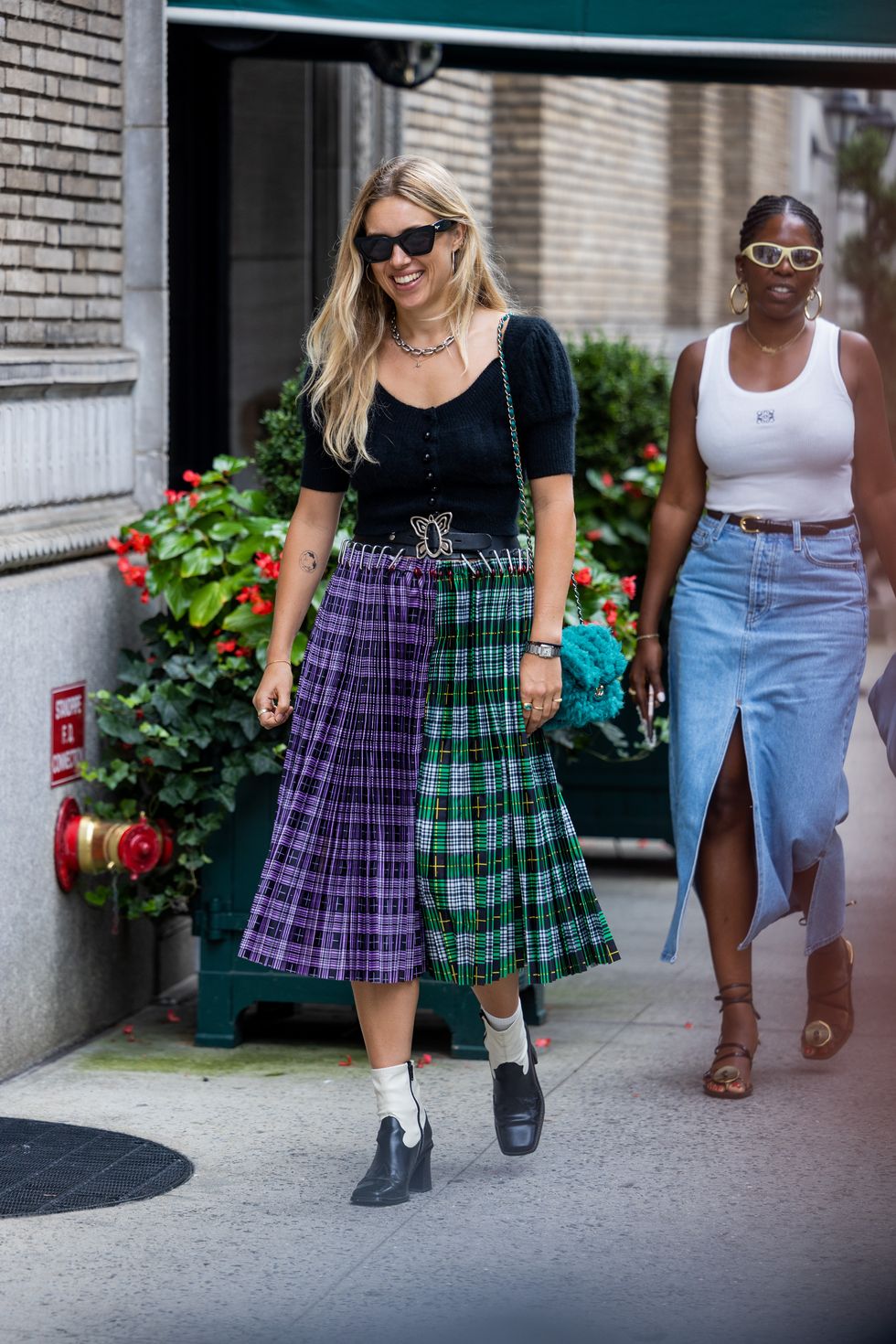 new york, new york september 12 a guest wearing miu miu two tone checkered skirt outside coach on september 12, 2022 in new york city photo by christian vieriggetty images