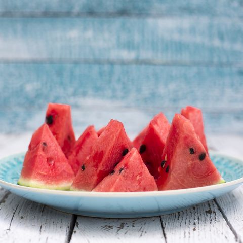 chopped watermelon on blue plate