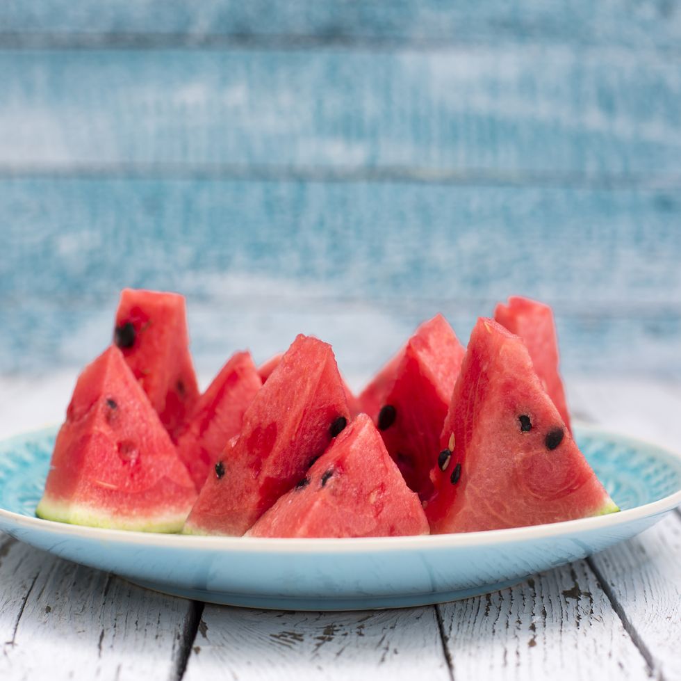 https://hips.hearstapps.com/hmg-prod/images/chopped-watermelon-on-blue-plate-royalty-free-image-1626872942.jpg?crop=0.667xw:1.00xh;0.147xw,0&resize=980:*