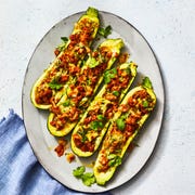 chorizo stuffed zucchini a plate of green zucchini boats stuffed with chorizo