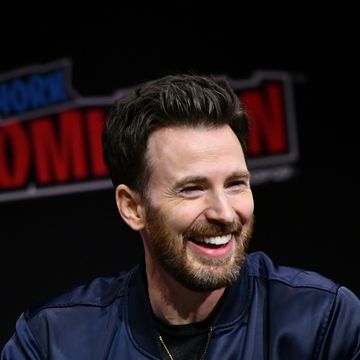 chris evans smiling at a 2023 nycc panel
