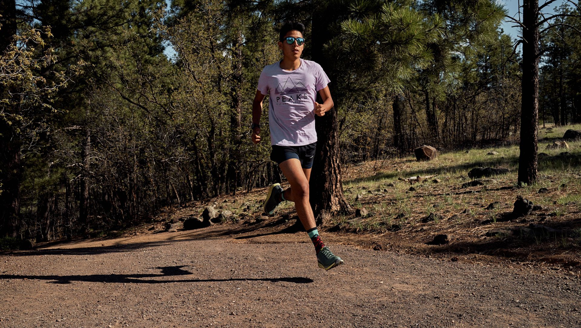 solo runner on a trail in arizona in the sunshine in 2019