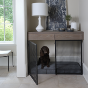 built in dog crate with a dog in it
