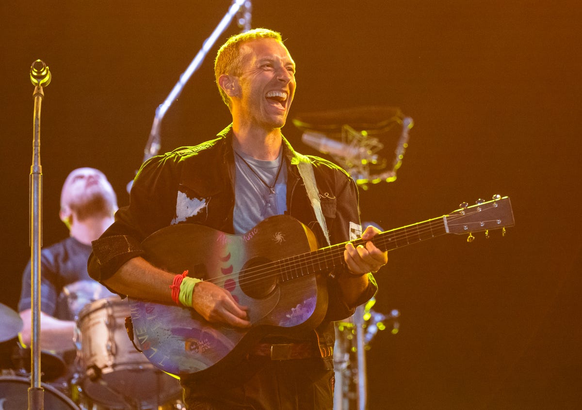 Dakota Johnson Attends Chris Martin's Coldplay Show At Glastonbury