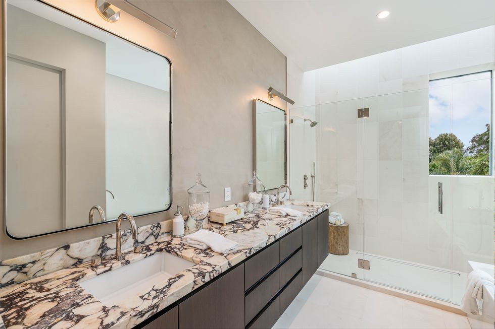 double bathroom with marble counters