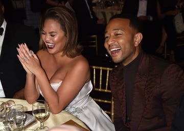 Chrissy Teigen and John Legend laughing at the Critics' Choice Awards