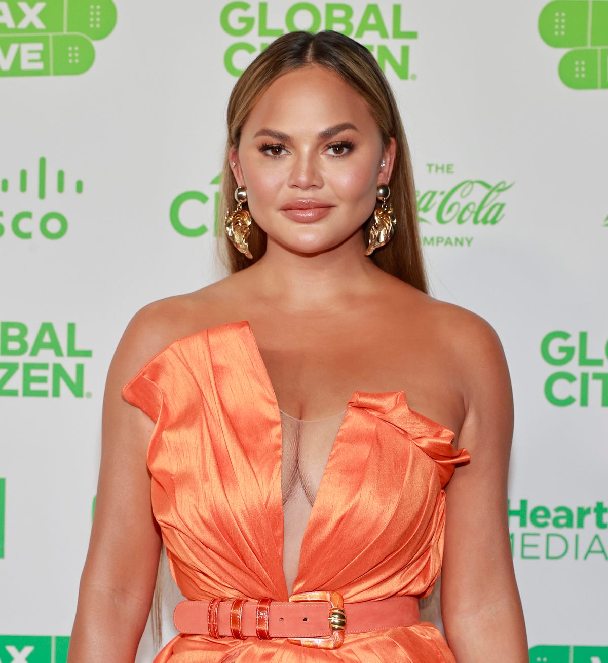 Chrissy Teigen shared a fully nude selfie showing fans her bizarre tan lines